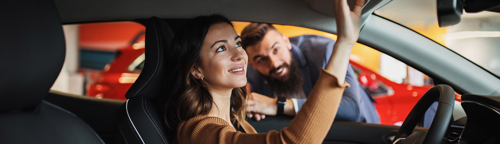 Young woman buying a new car