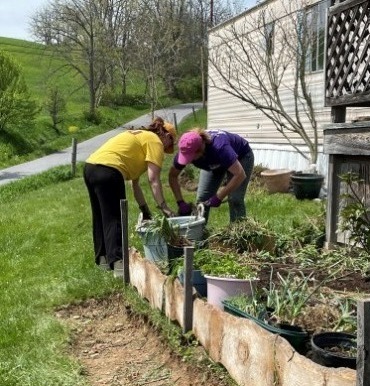 United Way team weeding and gardening