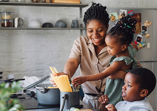 Young family cooking in kitchen